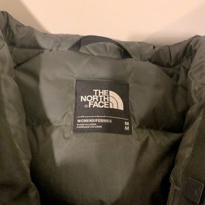 Green jacket with hooded fur.  Worn for a couple months.  Cleaned at cleaners.